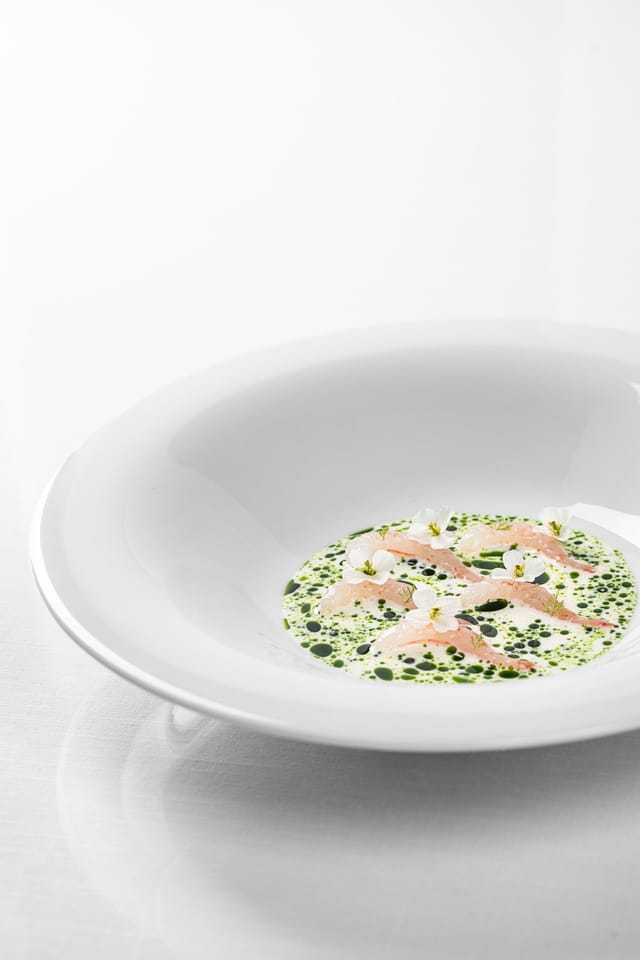 Shrimp with flowers in a white bowl