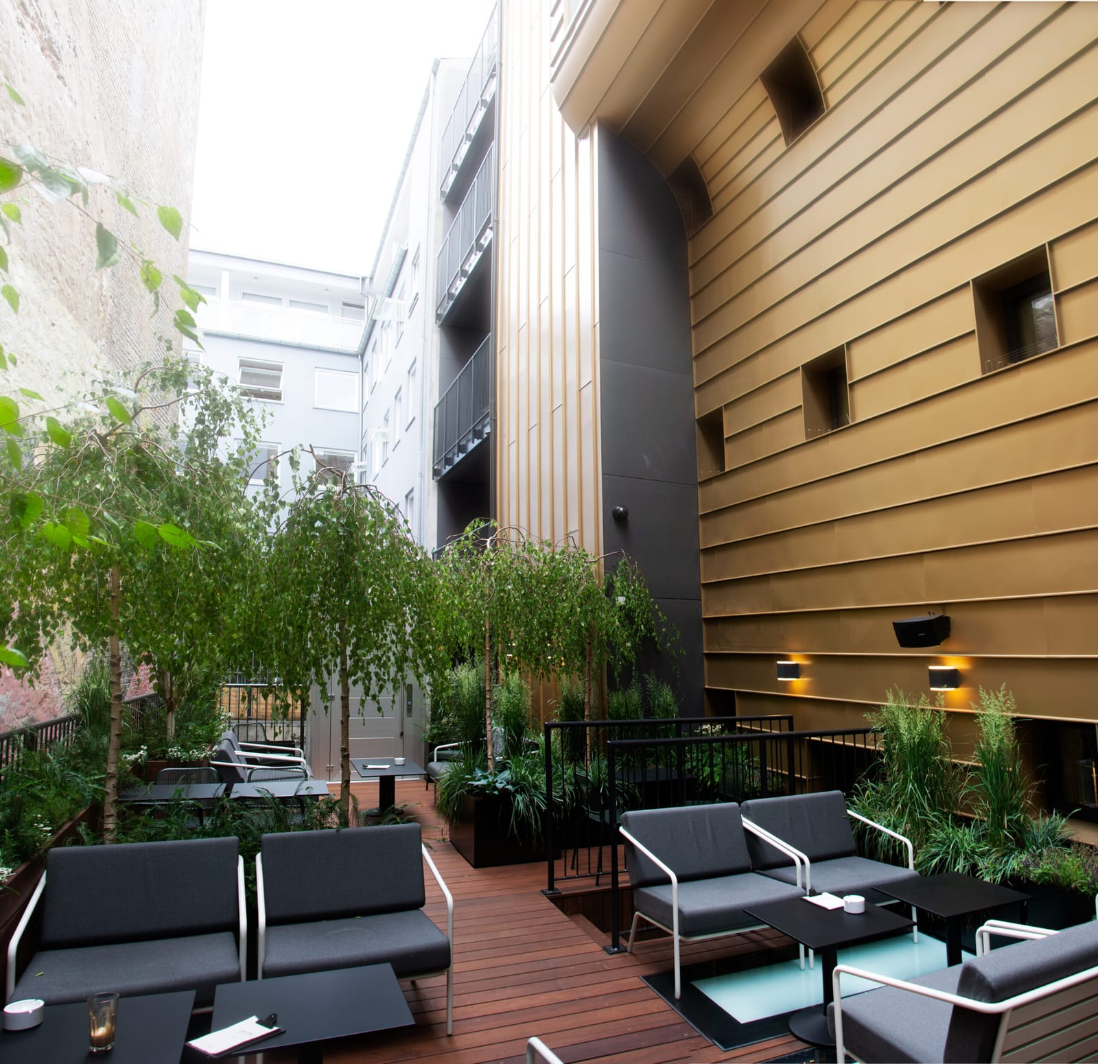 The courtyard terrace beside the bronze façade