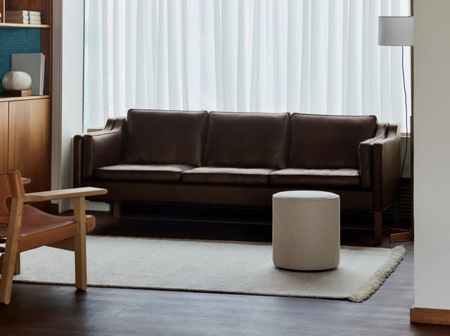 The 2213 Sofa beside a Spanish Chair