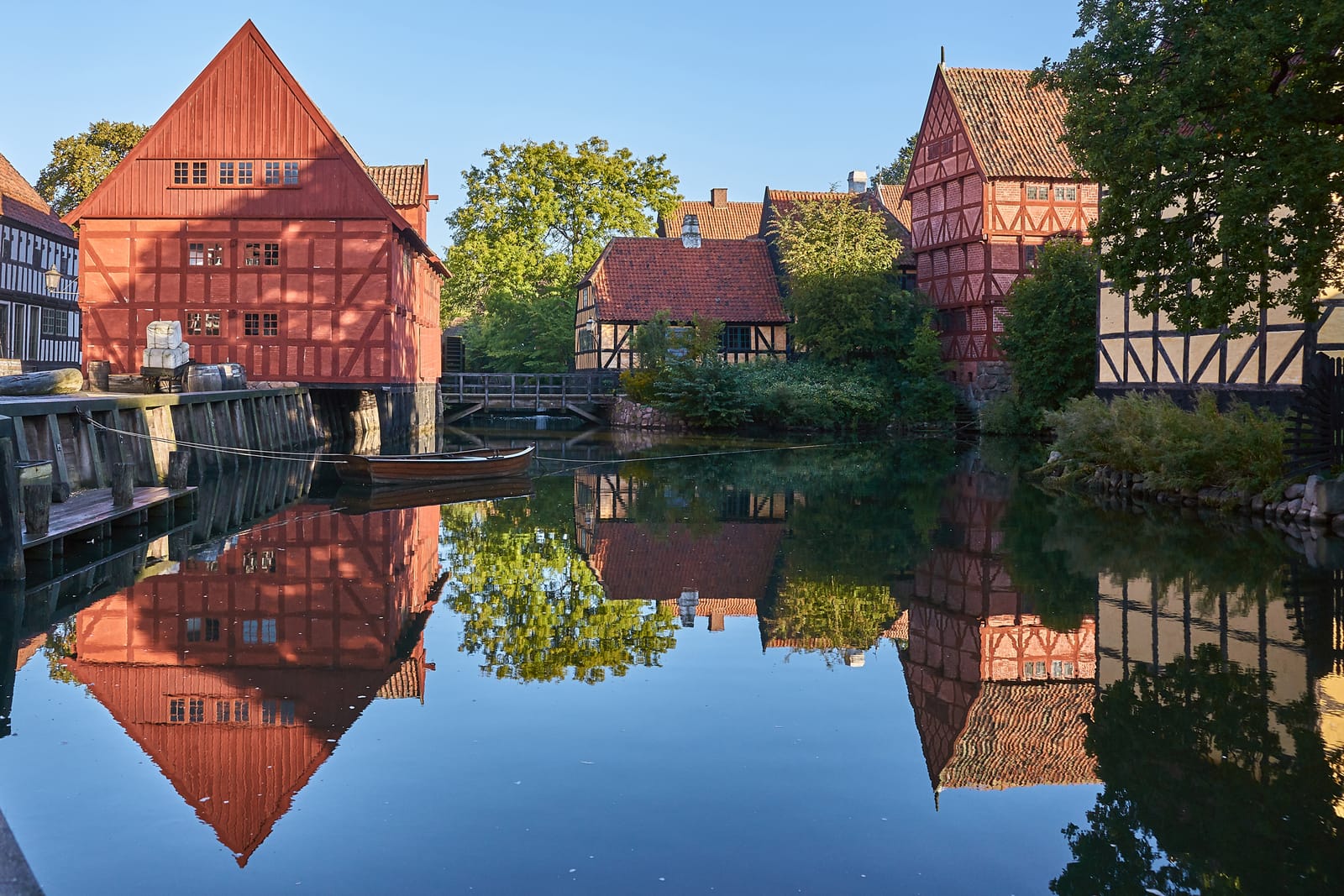 Half-timbered houses reflected in the millpond