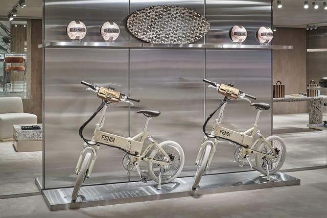 Two FENDI x MATE bikes in a Fendi store