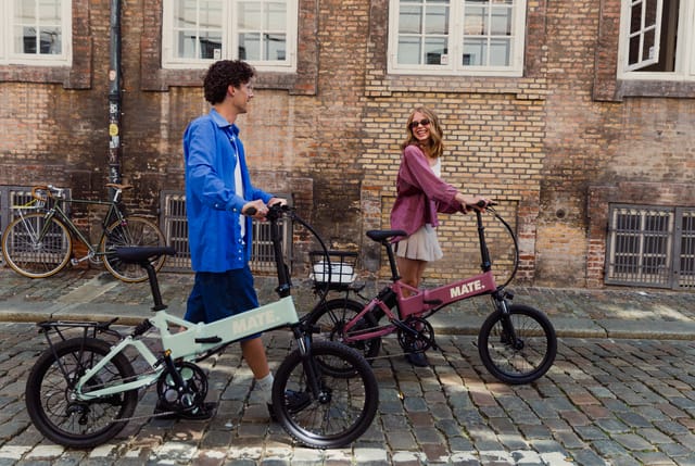 Two MATE ICONs wheeled along a cobbled street