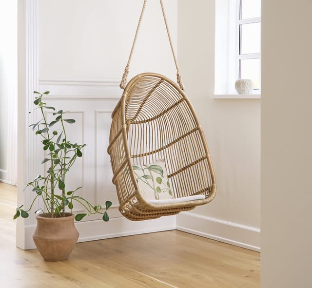 Renoir hanging chair in antique rattan
