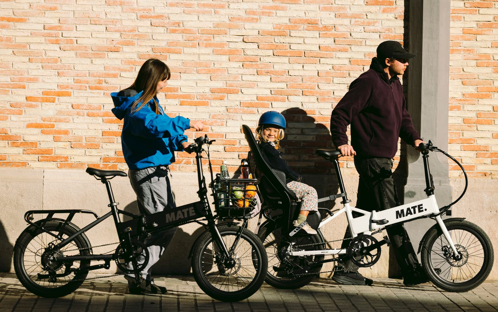 Two MATE GO+ bikes, one with a child in the rear seat