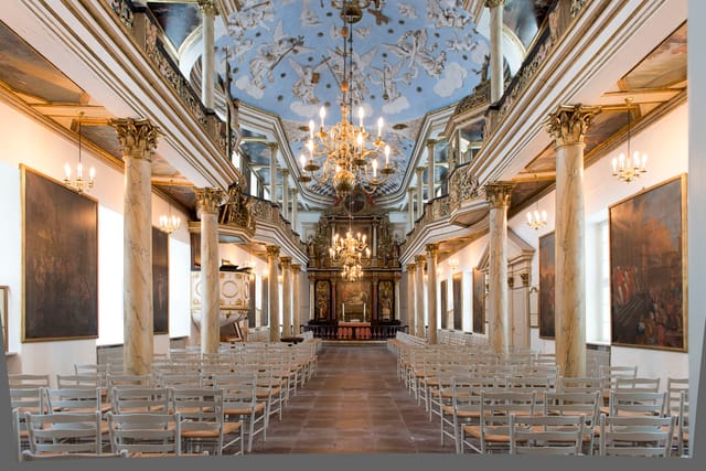 The palace church with its altarpiece and stucco ceiling