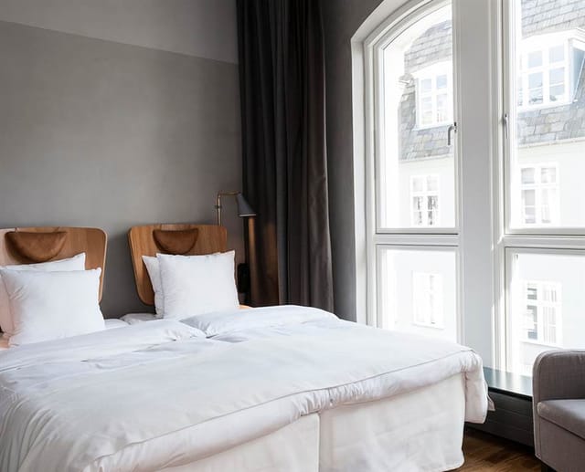 A deluxe room with its tall window