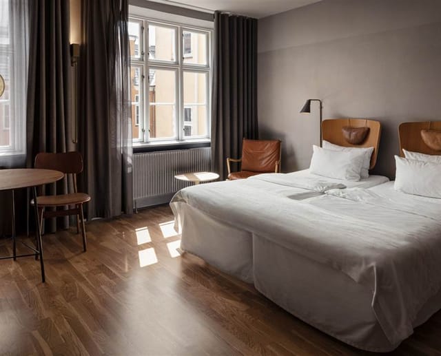 A superior double room with the chair-back headboards