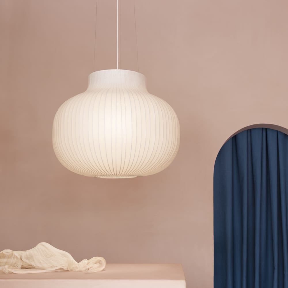 A closed Strand pendant lamp, lit