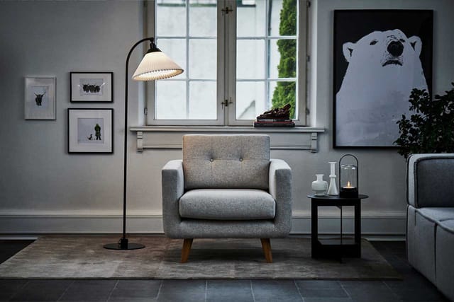 Model 368 lit beside an armchair