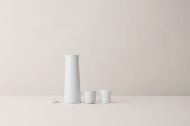 Thermodan jug with lid and two cups, white porcelain