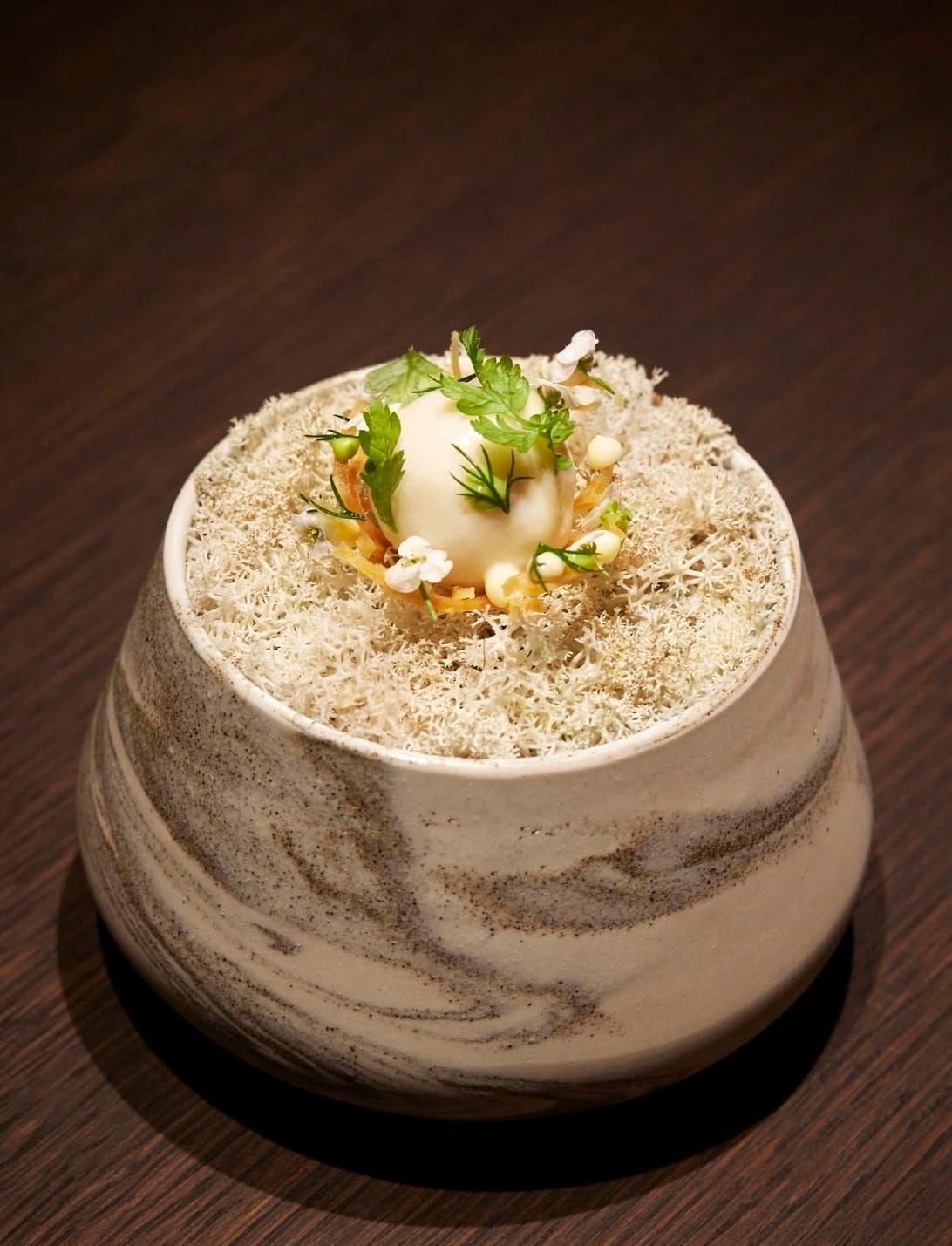 A dish from the menu on a bed of moss