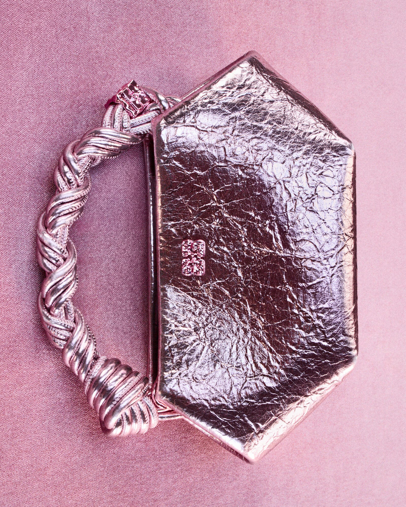 A metallic Bou Bag with a braided handle