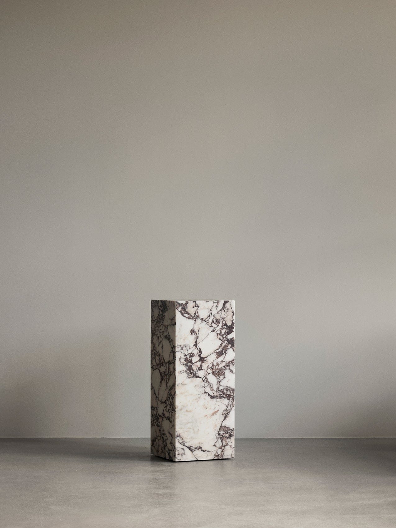 A Plinth Pedestal in veined white and purple marble