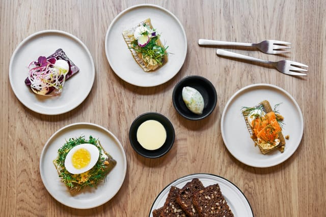 Pieces of smørrebrød on herring and rye
