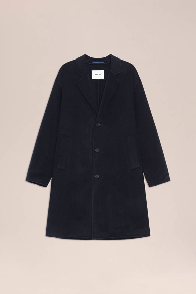 Kendrick coat in navy blue, laid flat