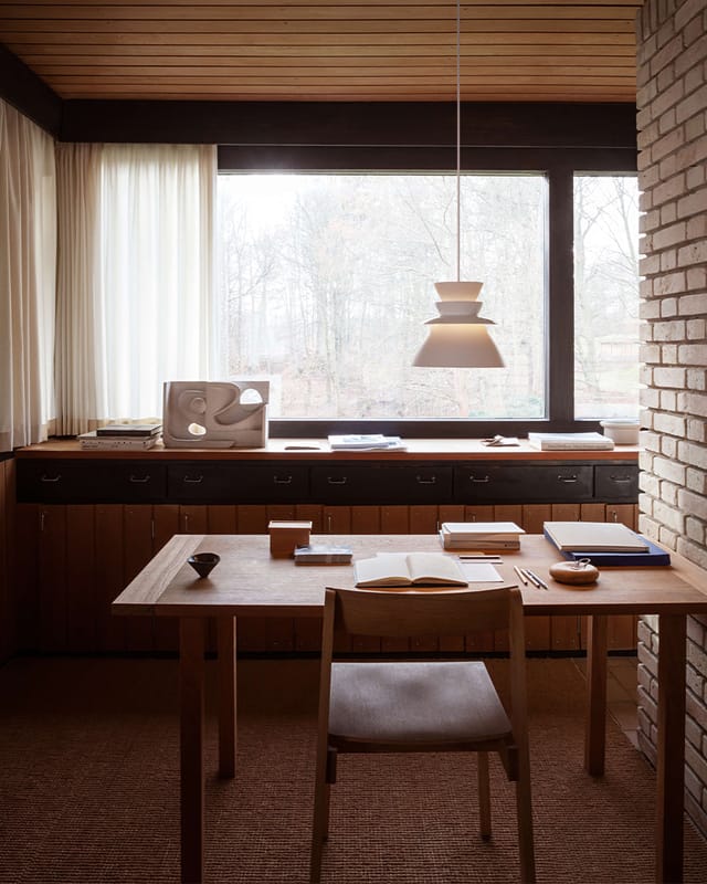 A white Sundowner over a desk by a window
