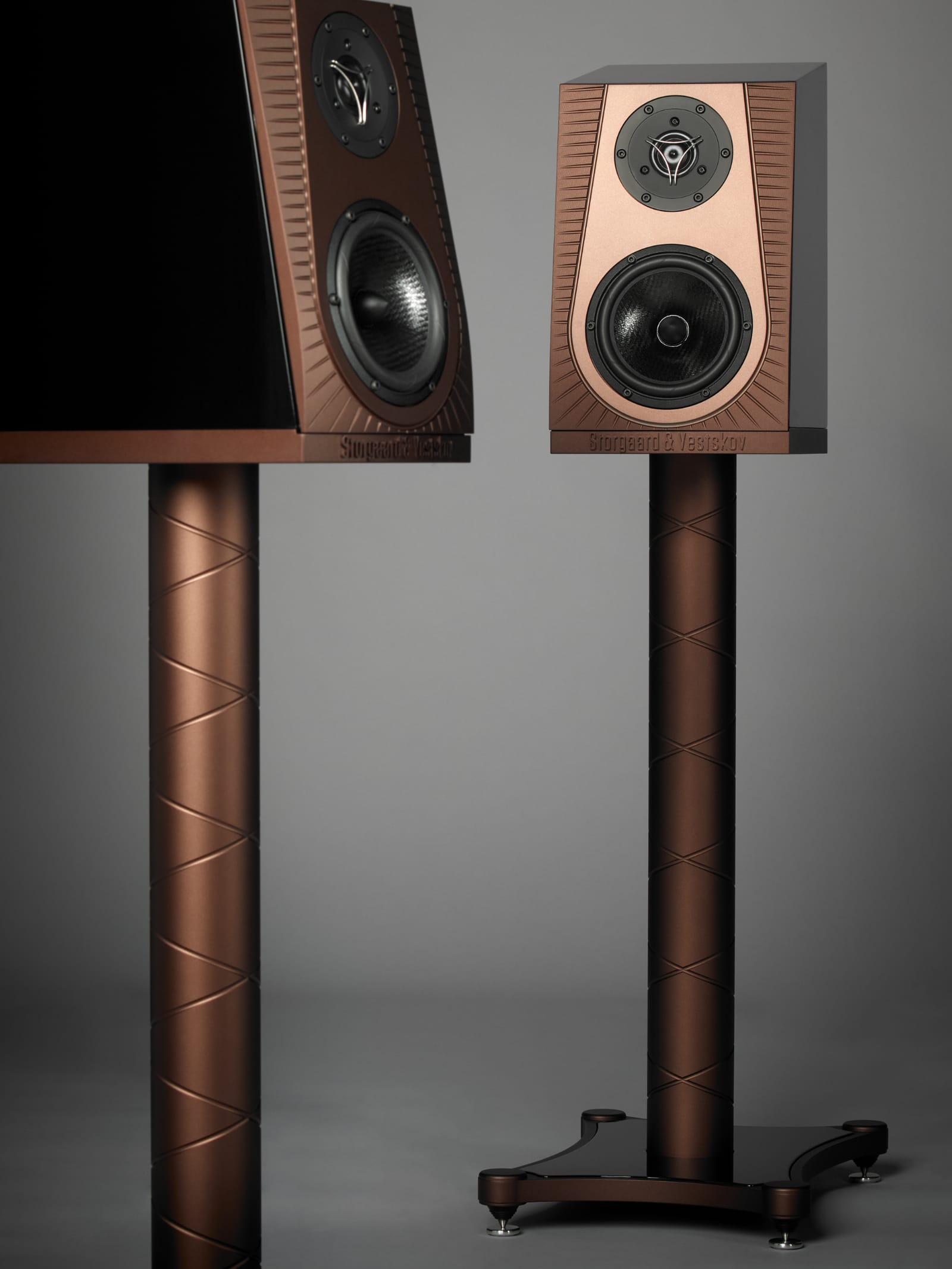 A pair of Frida speakers in copper on their stands