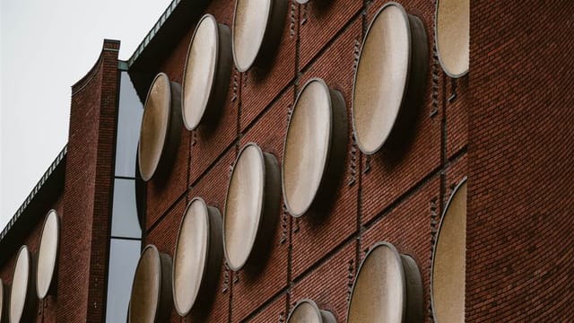 The golden discs on the old beer storage building
