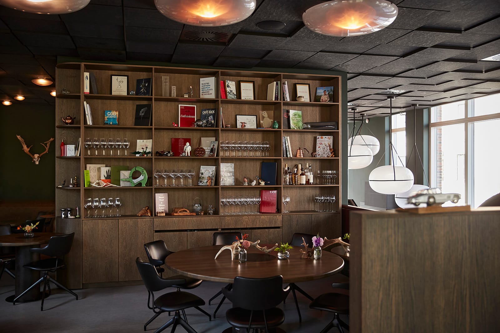 The dining room with its book wall