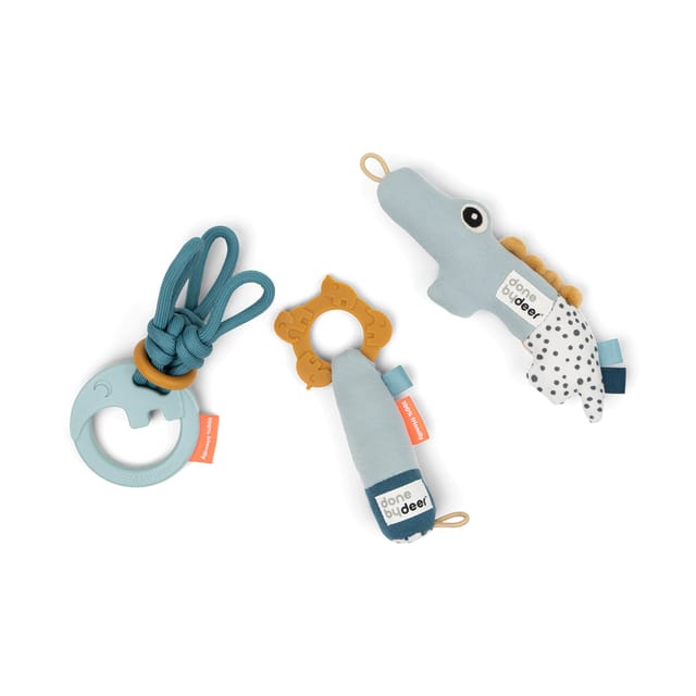 The three Tiny Activity Toys in blue: string rattle, teething rattle and Croco rattle