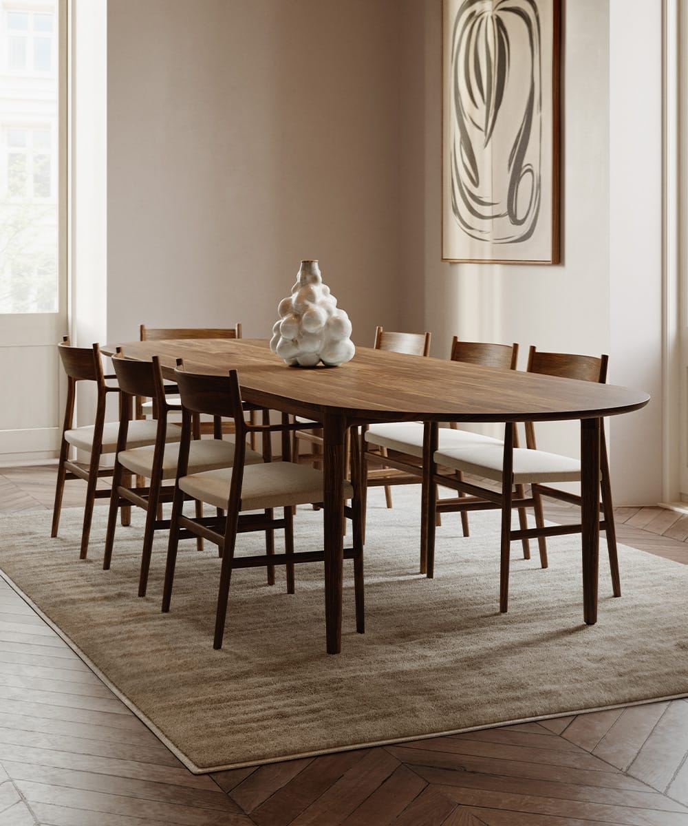 The Arv Plus Table with rounded ends and eight chairs