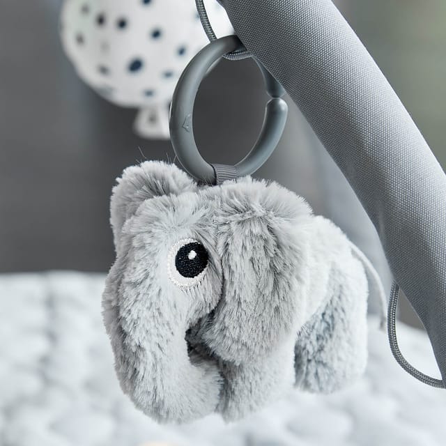 Elphee the elephant hanging from the play mat arch