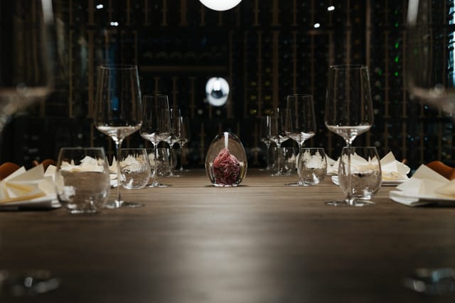 Table setting in front of the wine wall